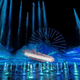 Millennium Falcon soars over the water in World of Color One
